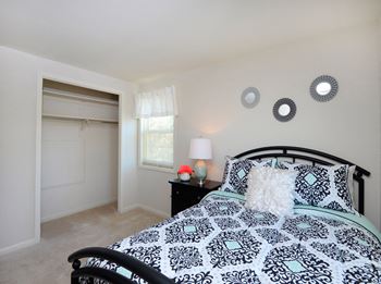 Large, carpeted bedrooms with natural light and plenty of closet space at Walnut Grove Townhomes* Apartments, Essex, 21221